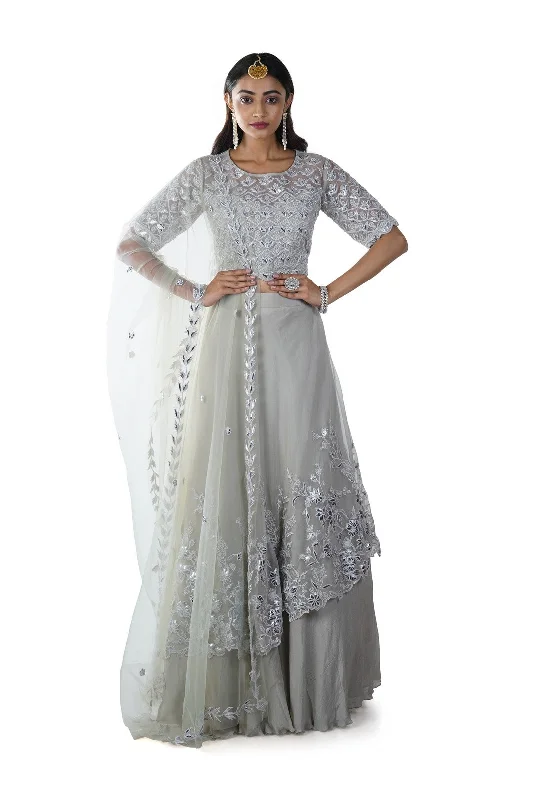 Reduced Prices Light Green Floral Rexin Embroidered Blouse with an Asymmetrically Layered Lehenga paired with a Dupatta Reduced Prices Light Green Floral Rexin Embroidered Blouse with an Asymmetrically Layered Lehenga paired with a Dupatta